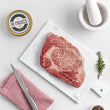 Load image into Gallery viewer, Petrusco Royal Osstera caviar in a tin next to a ribeye