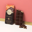 Load image into Gallery viewer, Venchi Gianduio chocolate bar with packaging against a pink background
