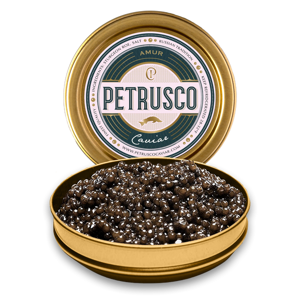 Petrusco Amur caviar in an open tin with the lid behind it.