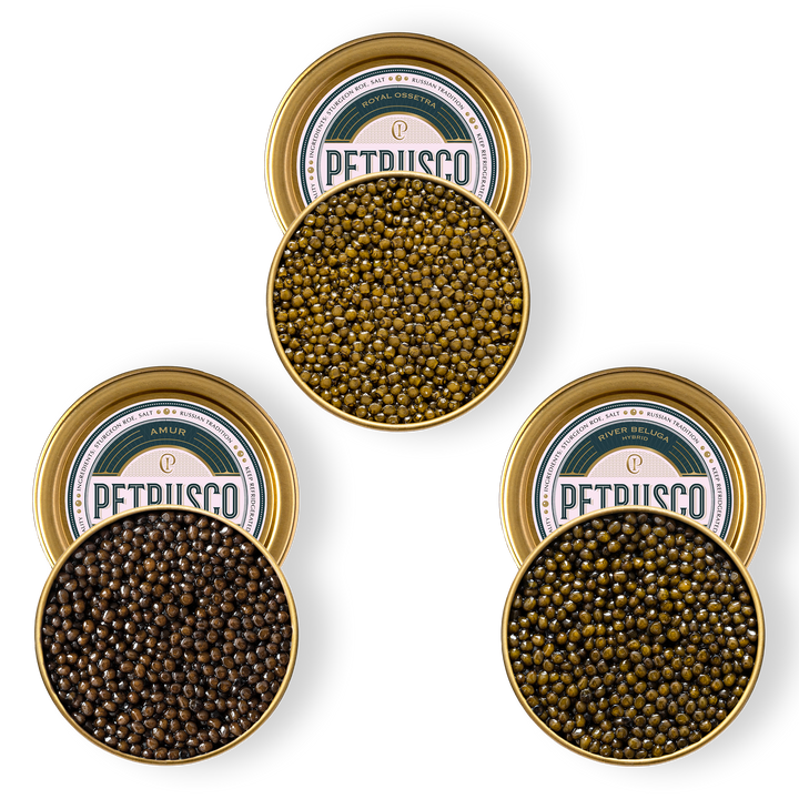 Royal Ossetra, River Beluga, and limited edition Amur caviar in open tins.