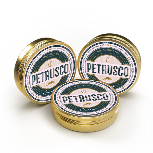 Closed tins of Petrusco Royal Ossetra, River Beluga, and Limited Edition Sevruga caviar sit side by side.