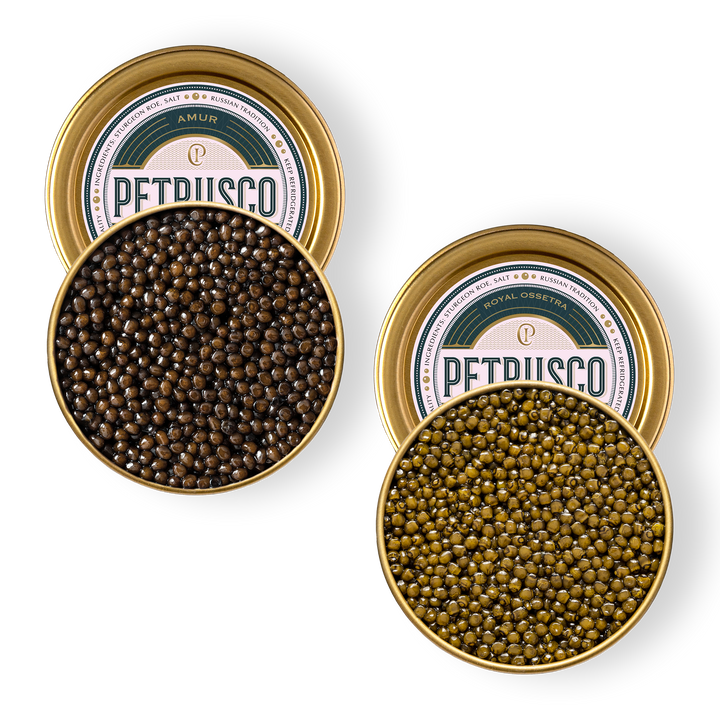 An overhead picture of Amur and Royal Ossetra caviar in open tins.