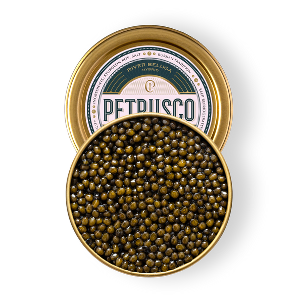 Open tin of Petrusco River Beluga Hybrid caviar showing large glossy olive-amber pearls on a white background.