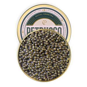 Petrusco Royal Ossetra Caviar in gold and emerald tin covered partially by the buttery sturgeon roe