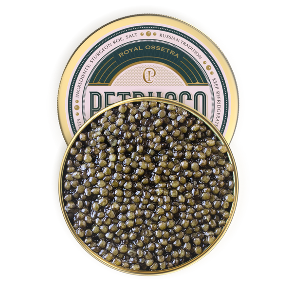 Petrusco Royal Ossetra Caviar in gold and emerald tin covered partially by the buttery sturgeon roe